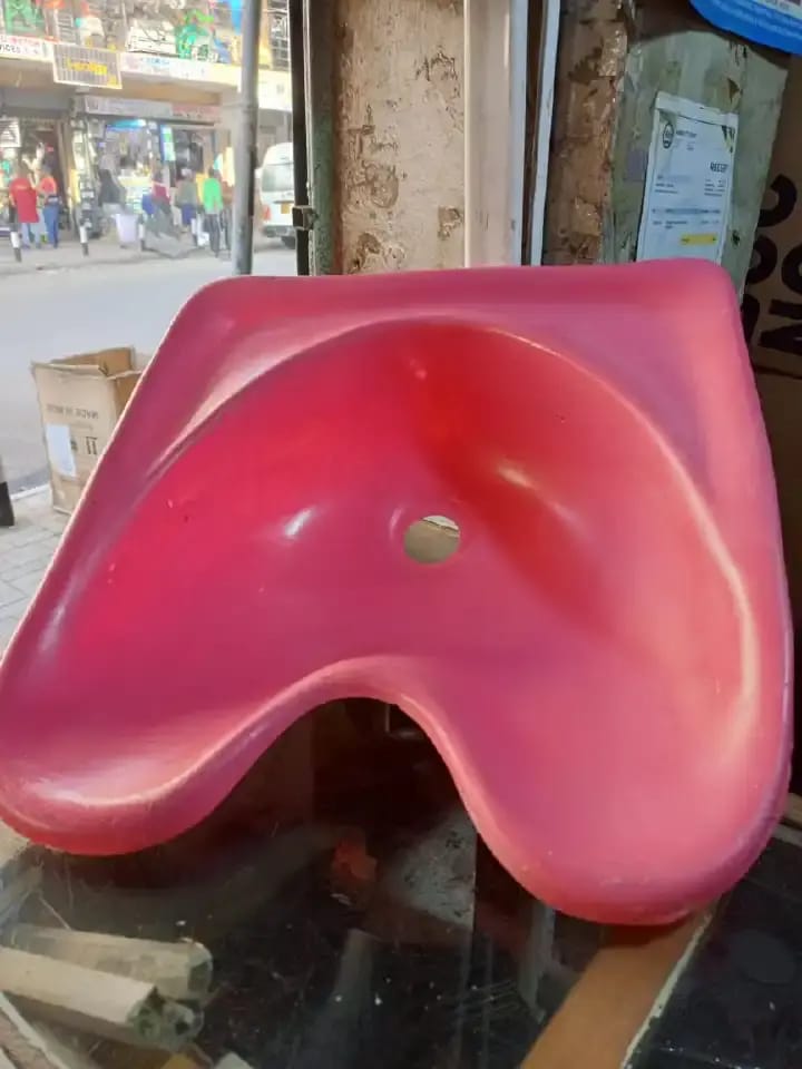 portable salon sink basin, typically used for hair washing in salons, barber shops, or homes. 

This type of sink is often made of durable materials like fiberglass or ABS composite. 

The design is o