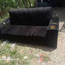 Velvet two-seater sofa with cup holders, potentially