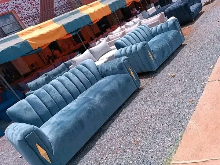 Velvet sofa set with channel tufting and gold-colored accents