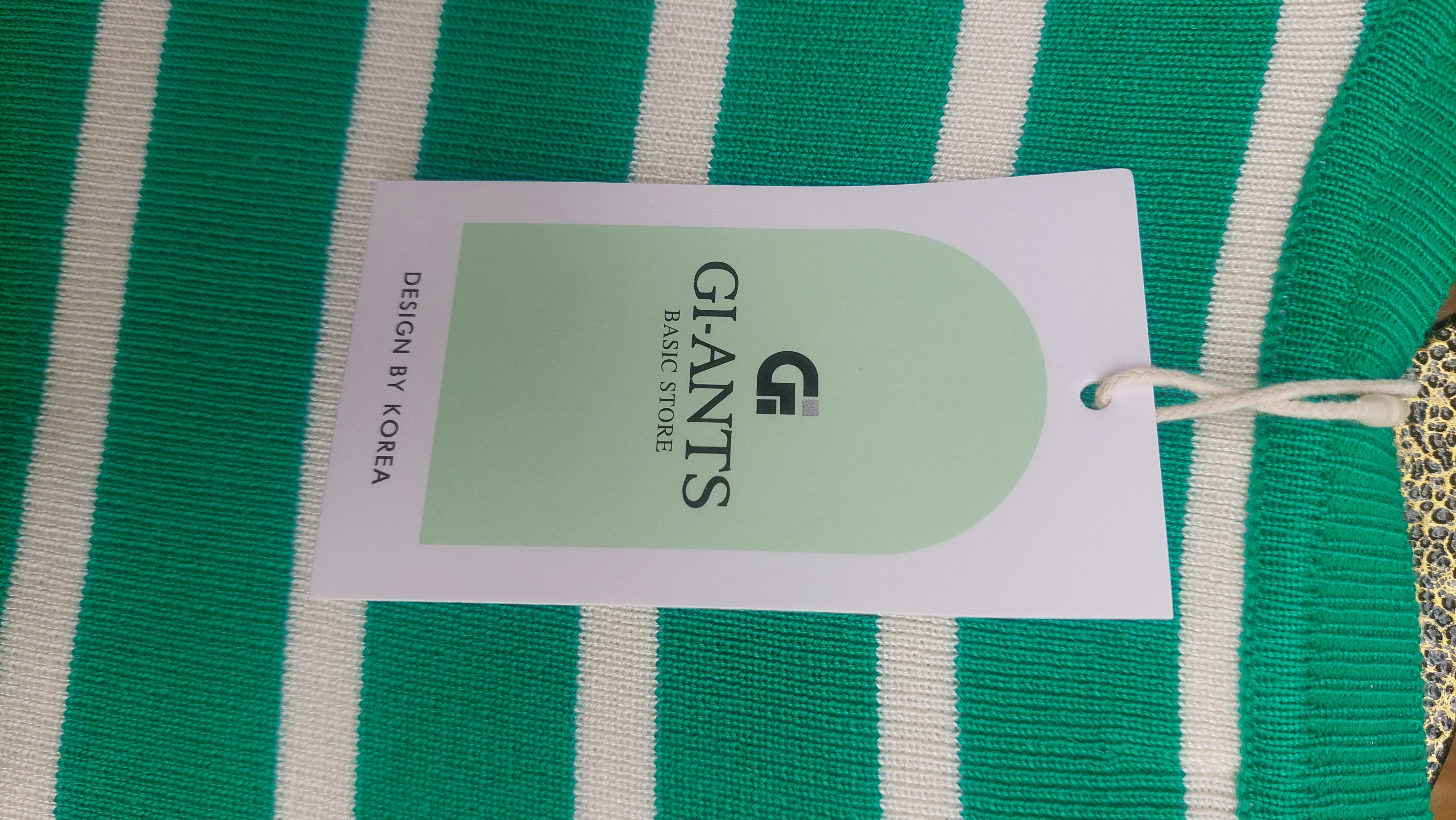 This is  a Vibrant Soft , ribbed knit   Green and white striped crop top a blend of classic style and a trendy fit.