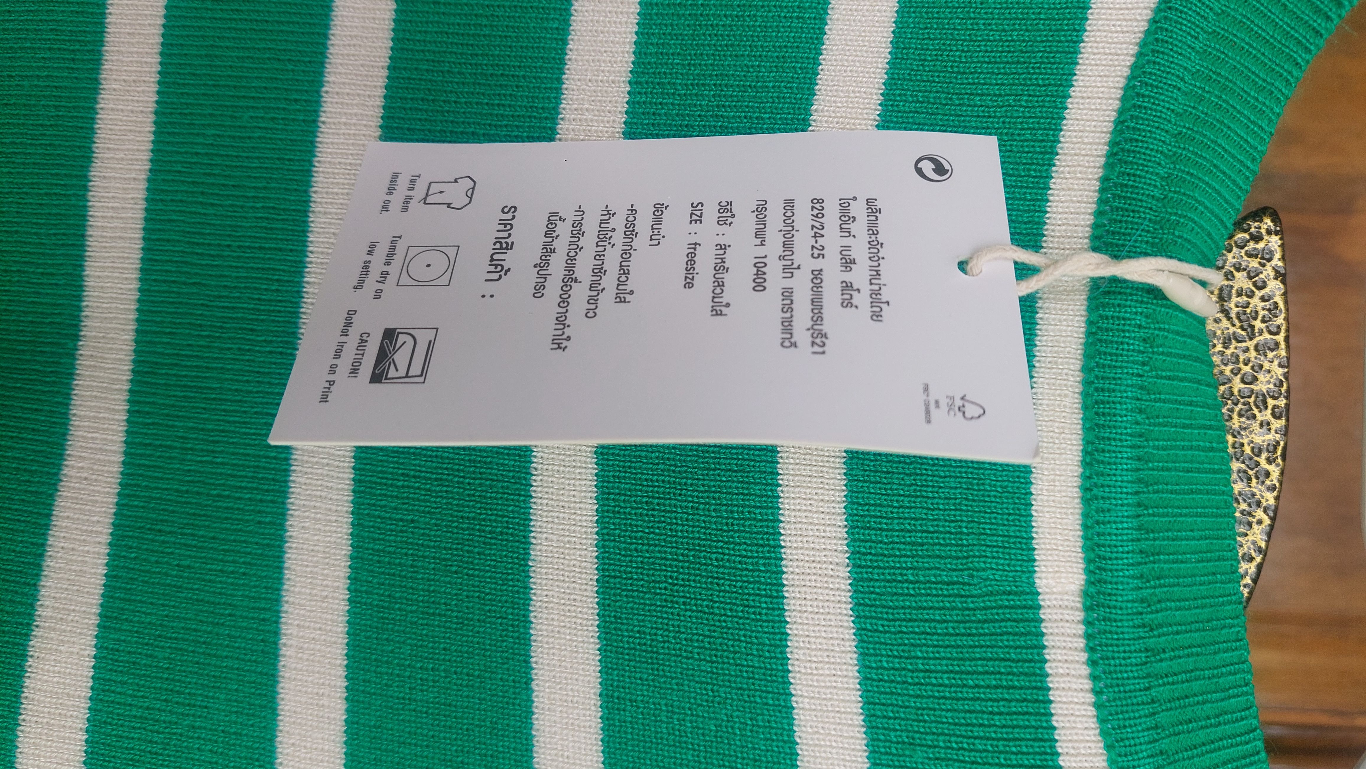 This is  a Vibrant Soft , ribbed knit   Green and white striped crop top a blend of classic style and a trendy fit.