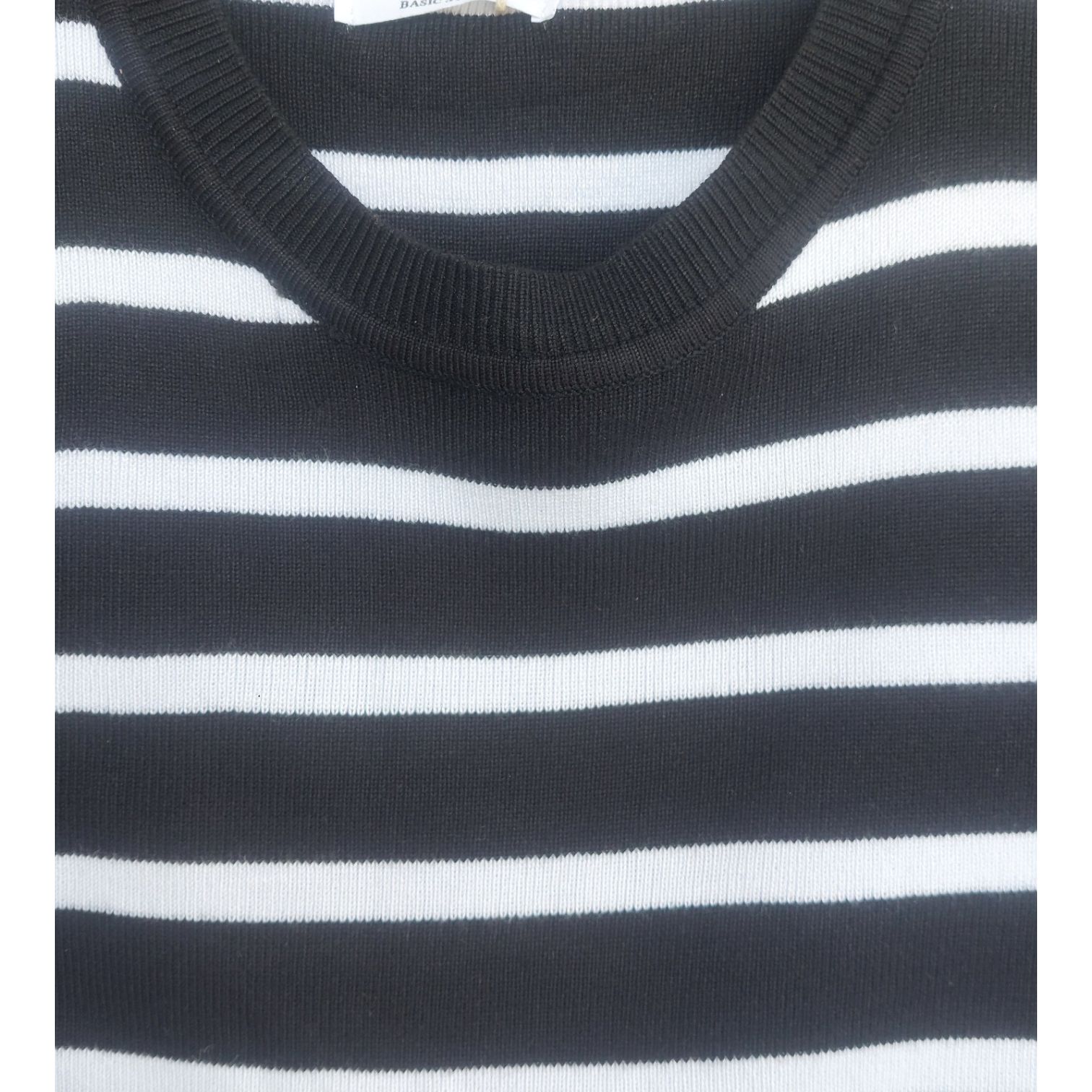 Unleash your inner Barbie with this glamorous and chic black and white striped crop top.