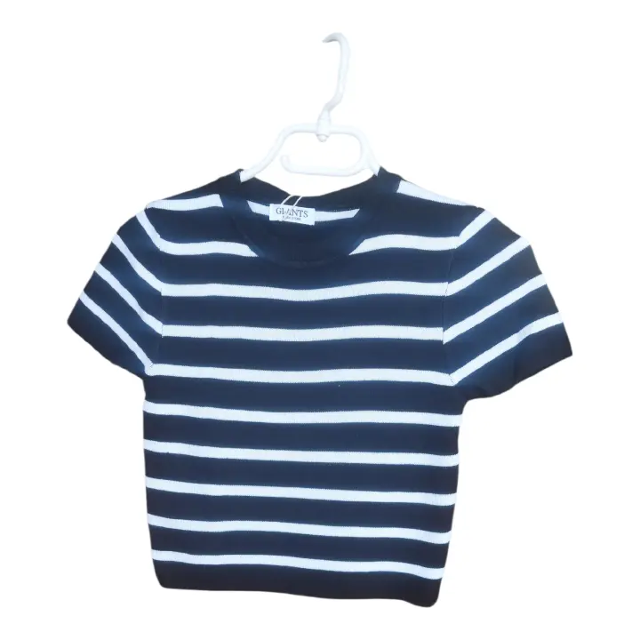 Unleash your inner Barbie with this glamorous and chic black and white striped crop top.