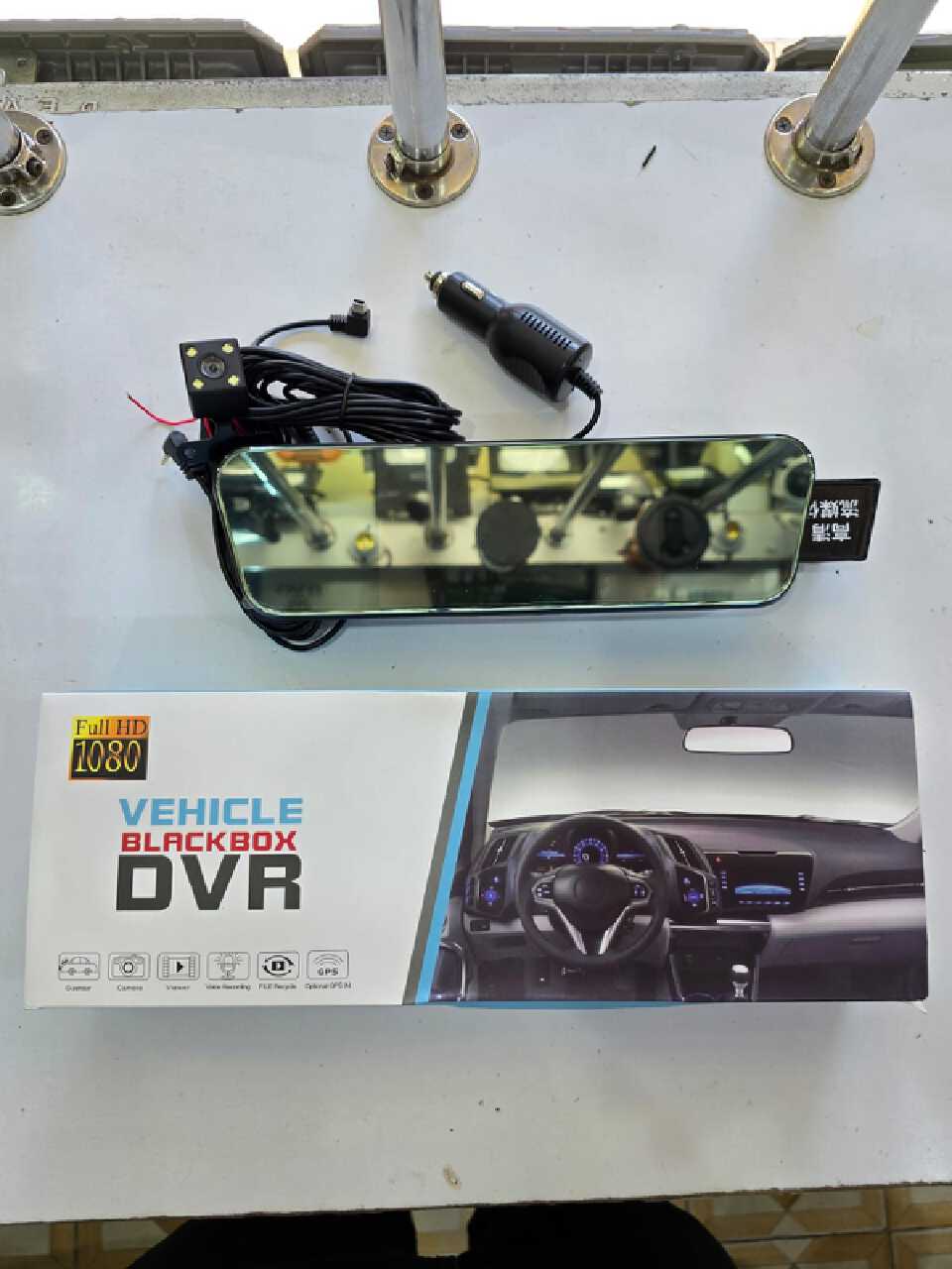 Vehicle Blackbox DVR (Digital Video Recorder), commonly known as a dash camera, which is designed to be installed as a rearview mirror replacement or attachment. It comes with a secondary rear camera