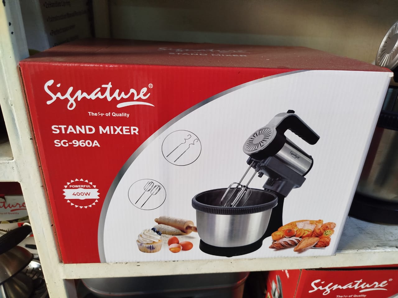 Signature Stand Mixer SG-960A. 
It features a powerful 400W motor. 
The mixer comes with a stainless steel mixing bowl and various attachments, including beaters and whisks. 
It is designed for hands-