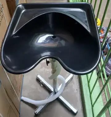 PORTABLE and adjustable salon sink. 
The basin is made of black PVC or durable ABS composite material. 
The stand and base are constructed from stainless steel. 
It is designed for convenience