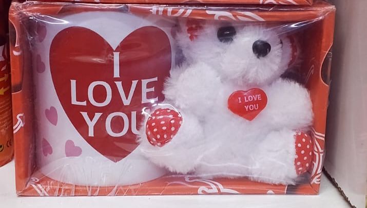 A romantic two-piece gift set featuring a white ceramic mug with an "I LOVE YOU" heart design and a soft, plush white teddy bear. Perfect for expressing love on special occasion