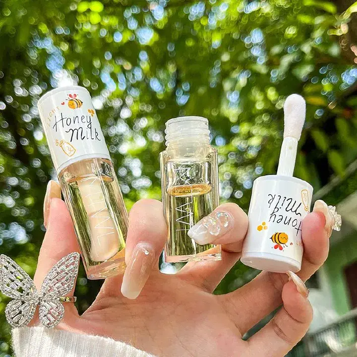 Fancy Modern Lip Gloss keeps lips shiny and sweet Lip Oil Lip Enhancer Serum Long Lasting Non-stick Moisturizes Vitamin E Lip Beauty Lip Care Serum