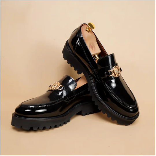 Black Patent Leather Loafers With Chunky Sole Featuring Luxurious Glossy Finish Golden Lion Logo Detail Durable Construction Cushioned Insole Slip-On Design Stylish Comfortable Statement Footwear