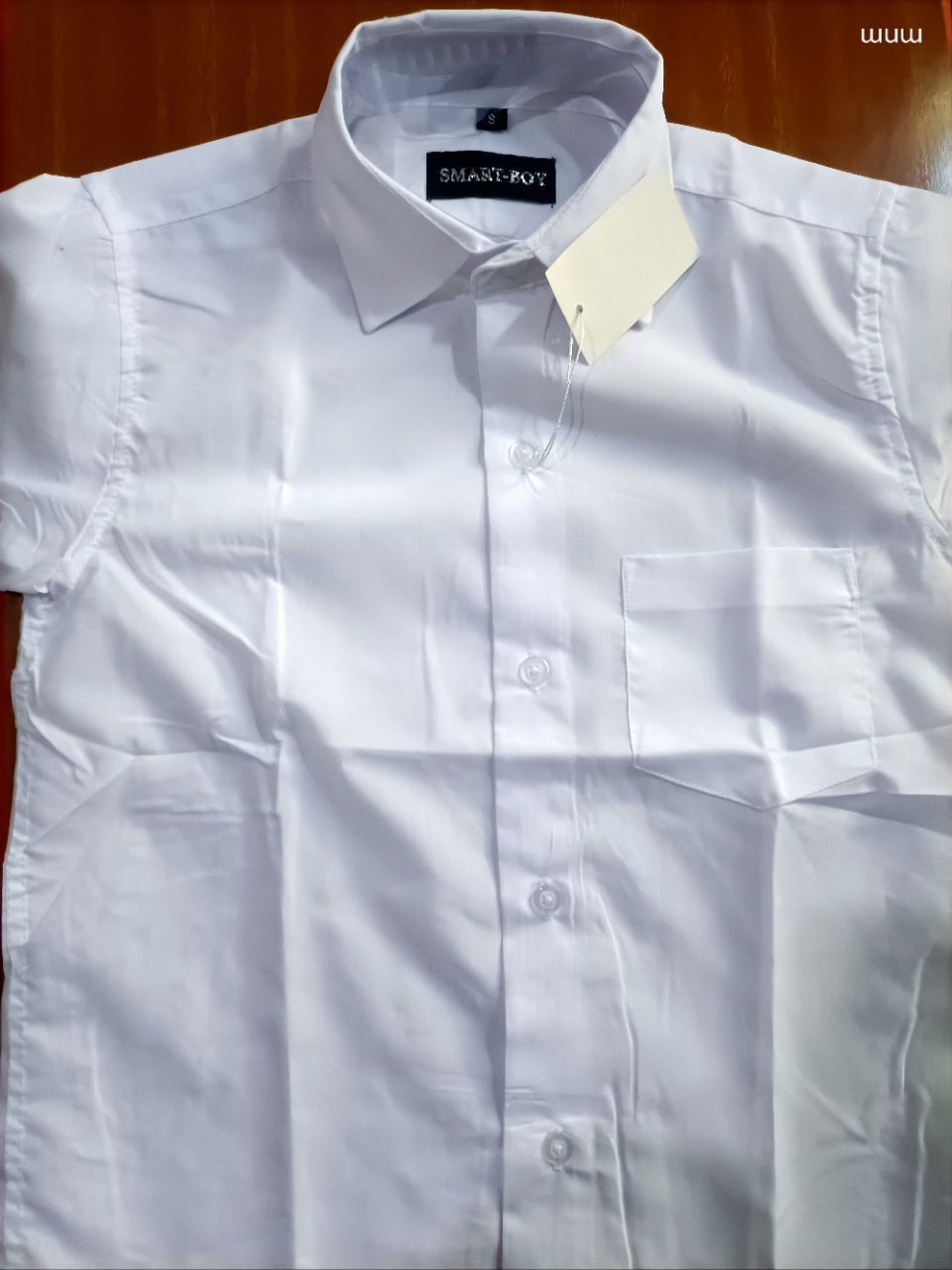 PURE WHITE PREMIUM OFFICIAL SHIRT. A bright, clean white color that resists quick fading and is easy to iron. Made from a
Cotton-Polyester blend that allows air circulation to keep you cool.