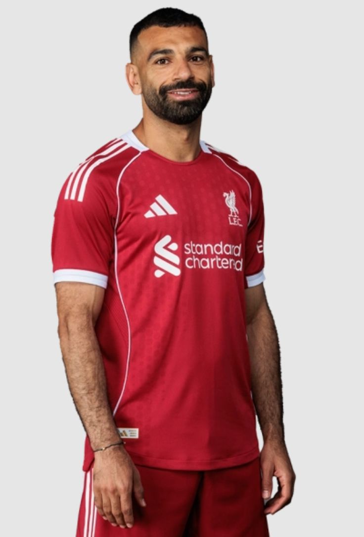 RED Liverpool 25/26 Home jersey.  Maximum Aura Only.Why It’s a Literal Flex:  A deep, rich red that screams authority. It’s the "Home Kit" energy that actually hits different with baggy denim.