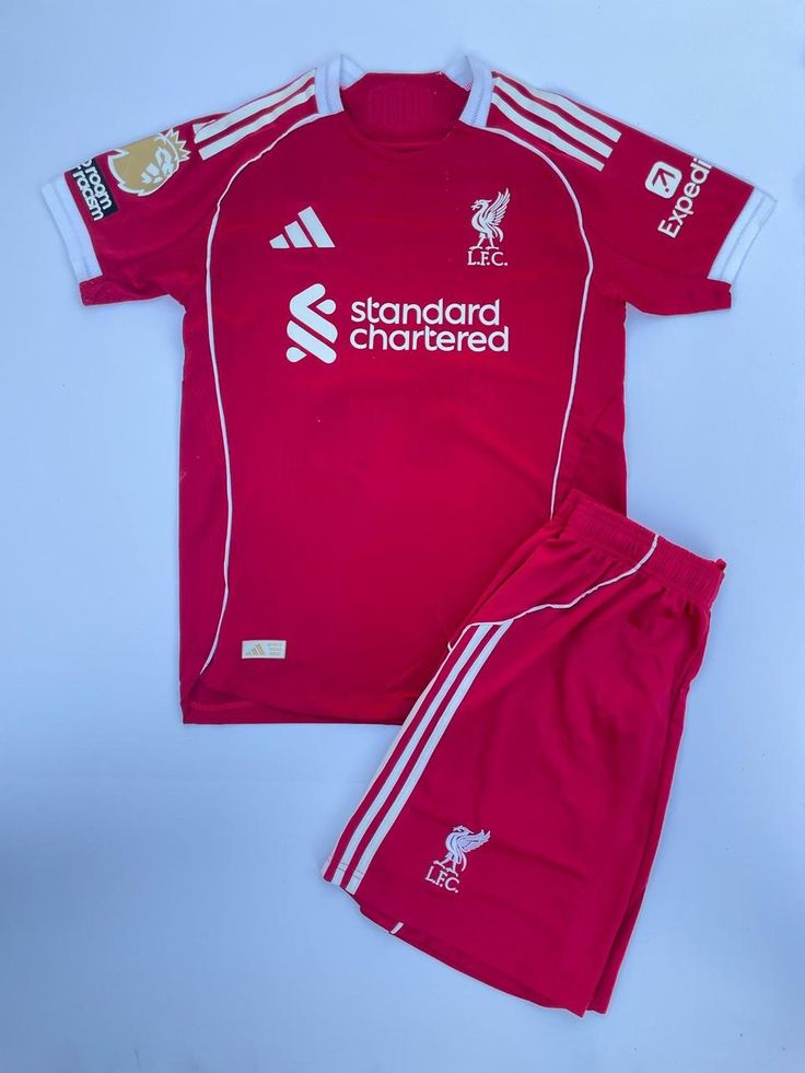 RED Liverpool 25/26 Home jersey.  Maximum Aura Only.Why It’s a Literal Flex:  A deep, rich red that screams authority. It’s the "Home Kit" energy that actually hits different with baggy denim.