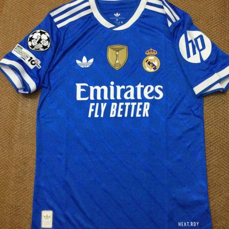 BLUE REAL MADRID 25/26 THIRD KIT. Real Madrid doesn't just play the game; they define it. Whether you’re pairing it with tracks for a workout or denim for a night out, you’re carrying the legacy.