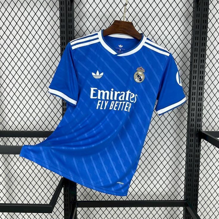 BLUE REAL MADRID 25/26 THIRD KIT. Real Madrid doesn't just play the game; they define it. Whether you’re pairing it with tracks for a workout or denim for a night out, you’re carrying the legacy.