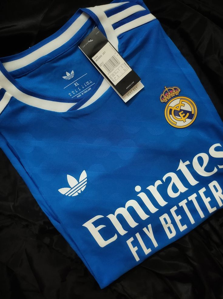 BLUE REAL MADRID 25/26 THIRD KIT. Real Madrid doesn't just play the game; they define it. Whether you’re pairing it with tracks for a workout or denim for a night out, you’re carrying the legacy.