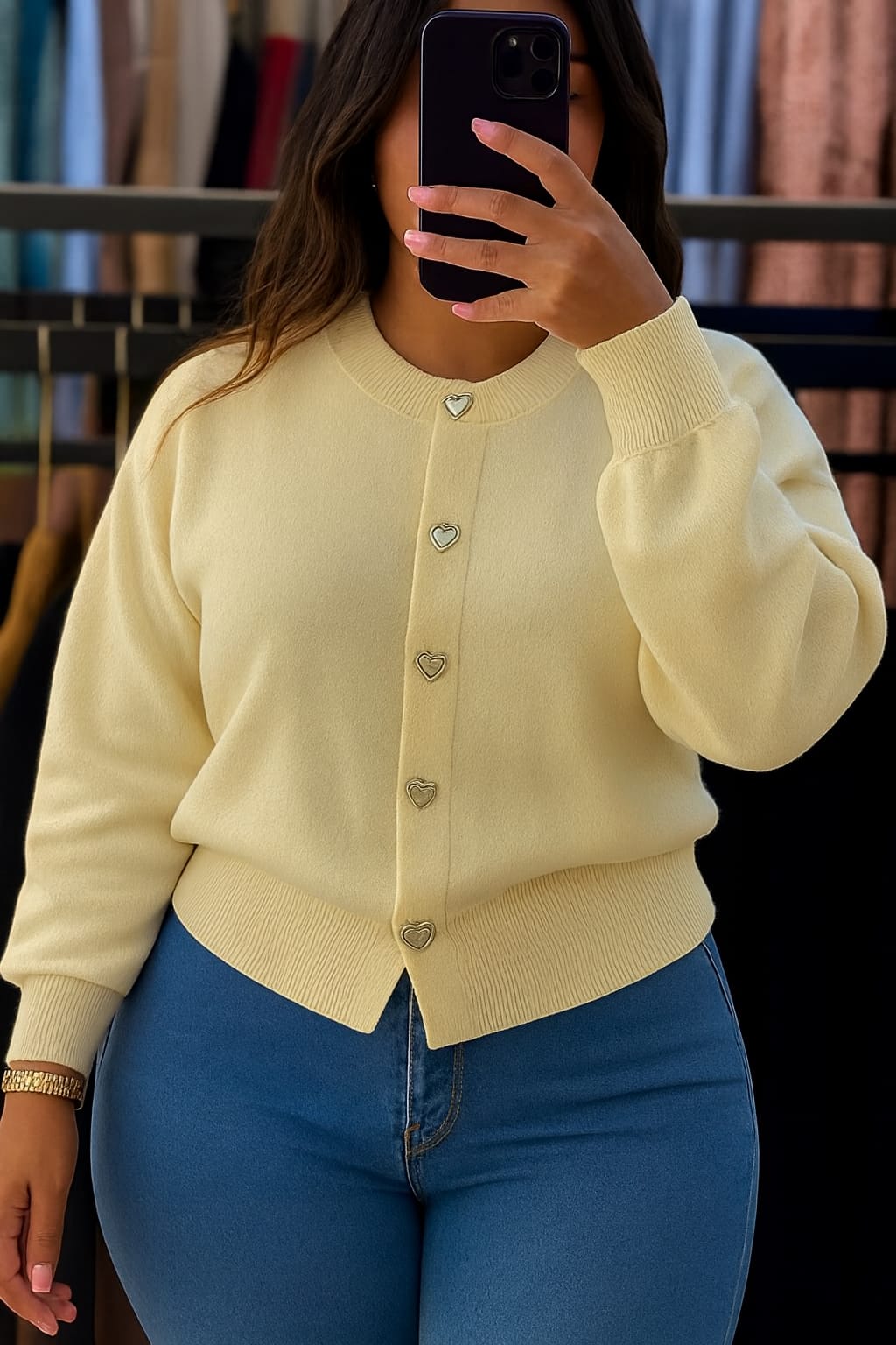 A knitted cardigan or sweater top characterized by its prominent silver/gold-tone heart-shaped buttons and has a slightly cropped length with long, voluminous balloon sleeves that end in ribbed cuffs.