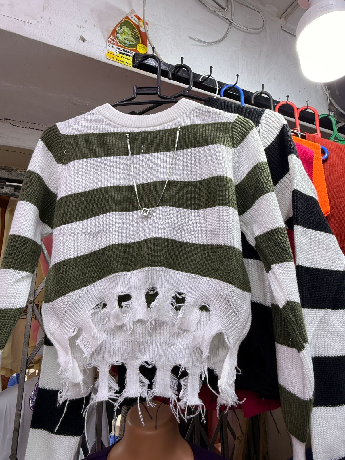 Women's Free Size Midnight Rebel Striped Cropped Sweater that has a silver chain.