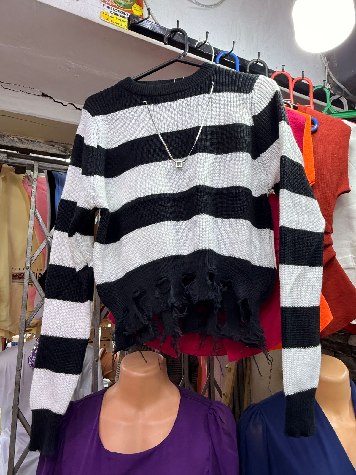 Women's Free Size Midnight Rebel Striped Cropped Sweater that has a silver chain.