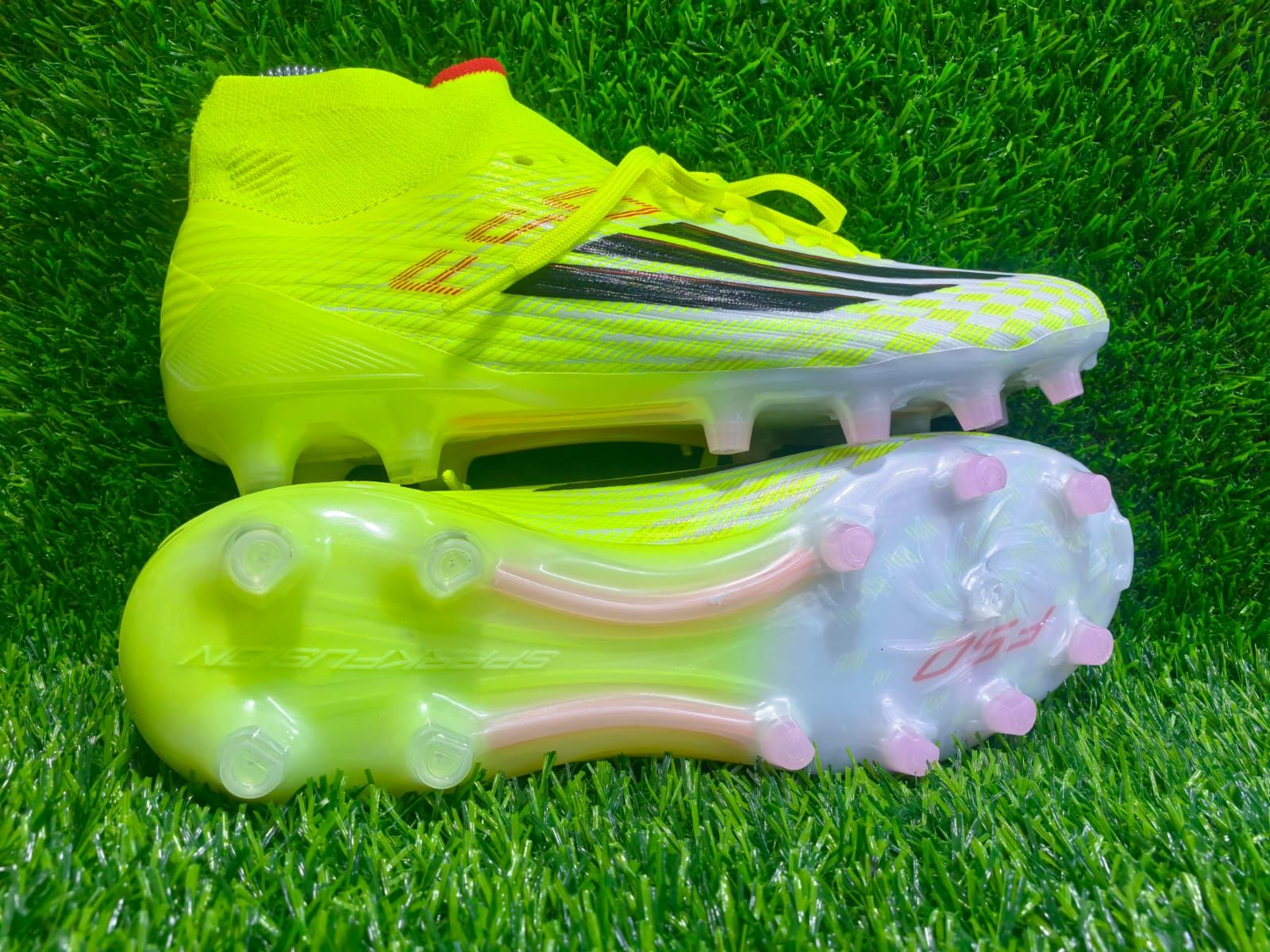 These are Adidas F50 Elite soccer cleats, specifically in the Team Solar Yellow / Core Black / Lucid Red colorway.