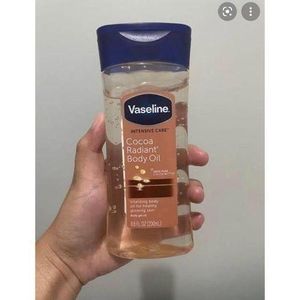 Vaseline Cocoa Radiant Body Oil With Pure Cocoa Butter blue lid
