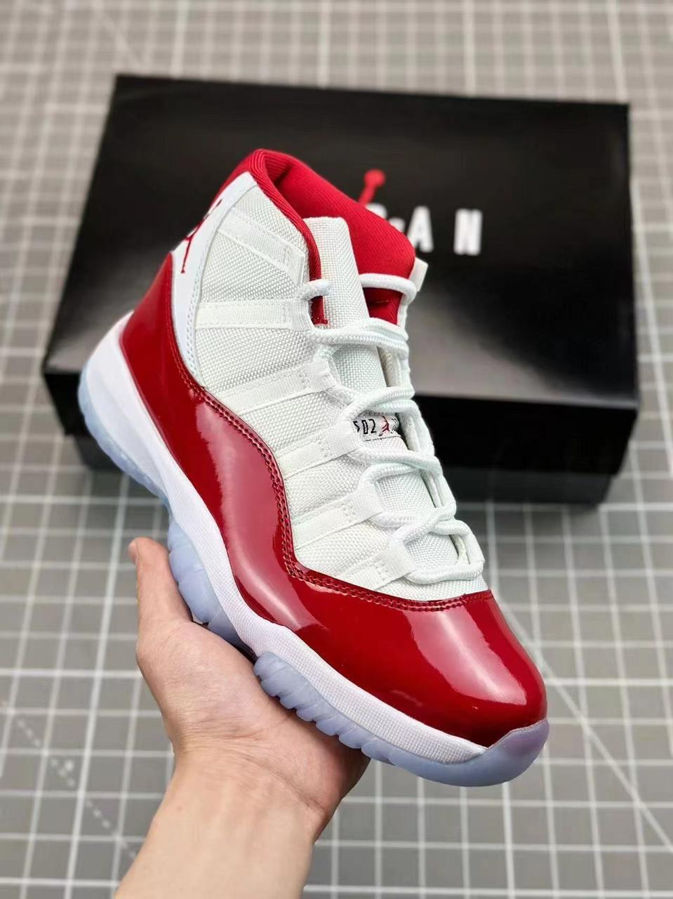 Iconic Air Jordan 11 sneakers featuring glossy patent leather, breathable mesh upper, responsive cushioning, and durable rubber outsole. Timeless design delivering premium comfort, style,