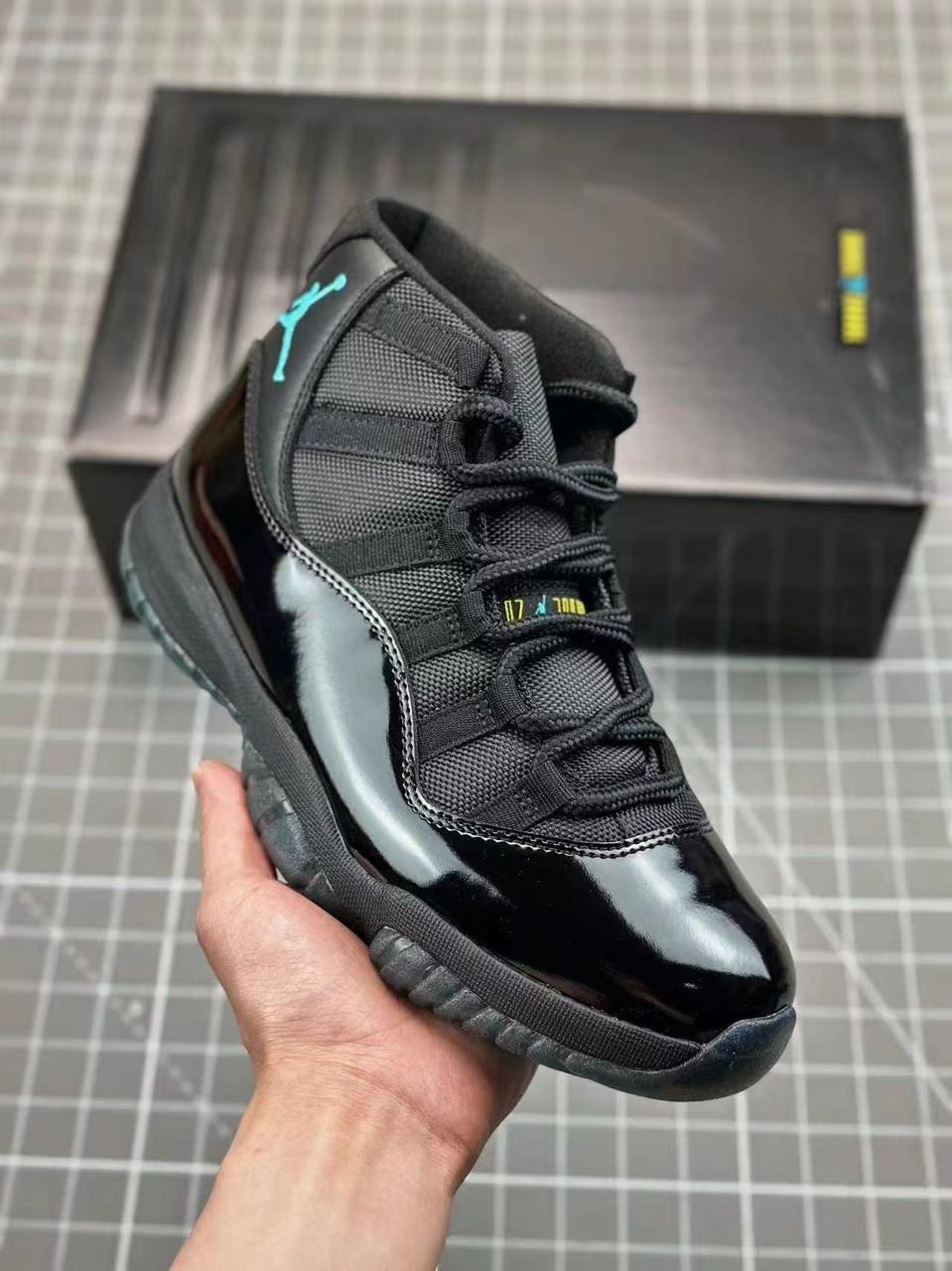 Iconic Air Jordan 11 sneakers featuring glossy patent leather, breathable mesh upper, responsive cushioning, and durable rubber outsole. Timeless design delivering premium comfort, style,