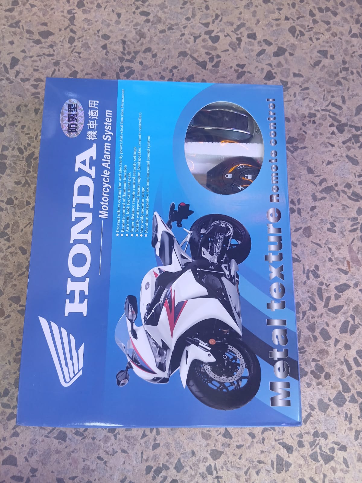 Honda Motorcycle Security Alarm System – Advanced Smart Anti-Theft Protection for Maximum Bike Safety, Smart Sensors, Remote Control & Real-Time Anti-Theft Protection. It also come with 1 KEY.