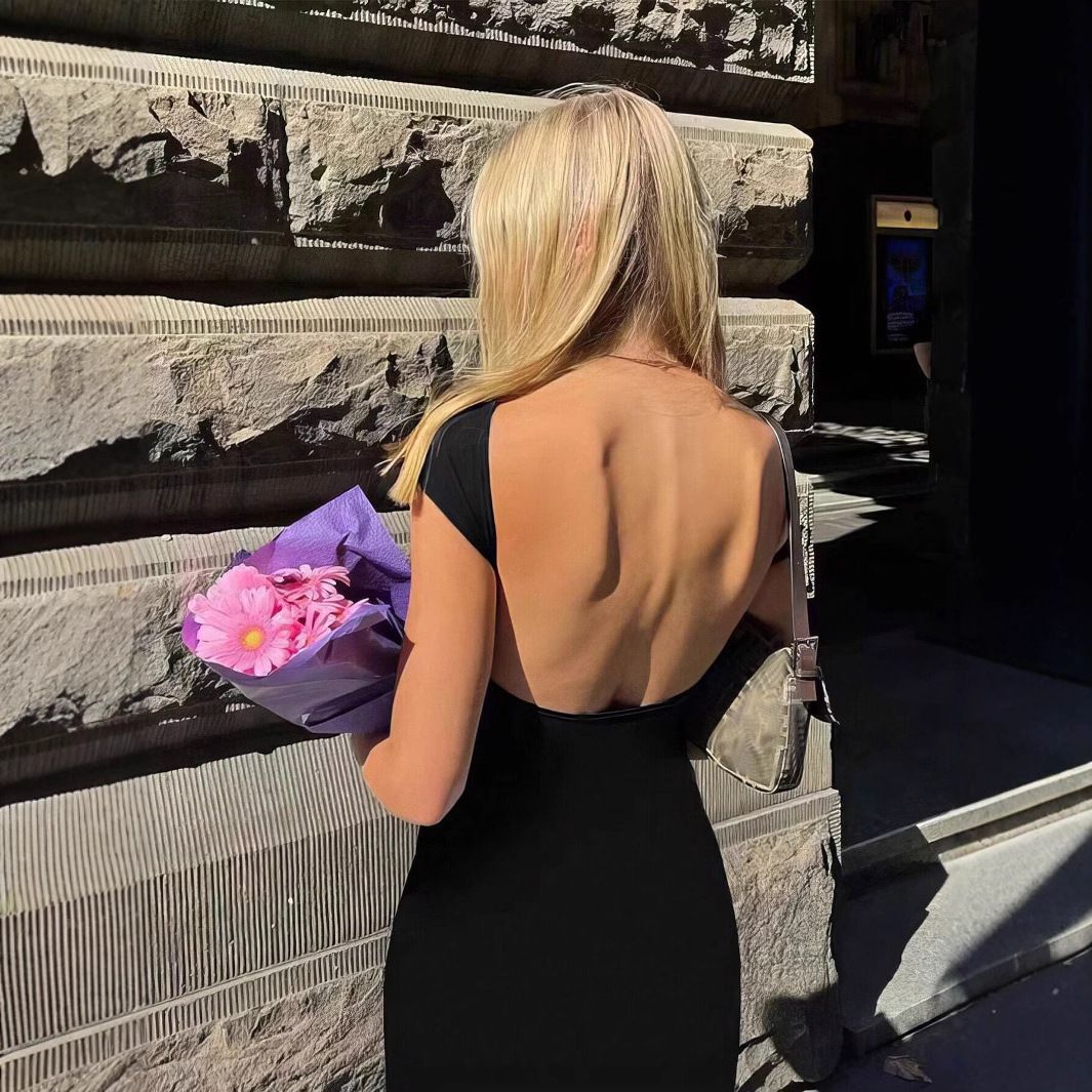Summer new women's dress solid color short-sleeved round neck backless slim bag hip long dress is suitable for daily leisure commuting parties.