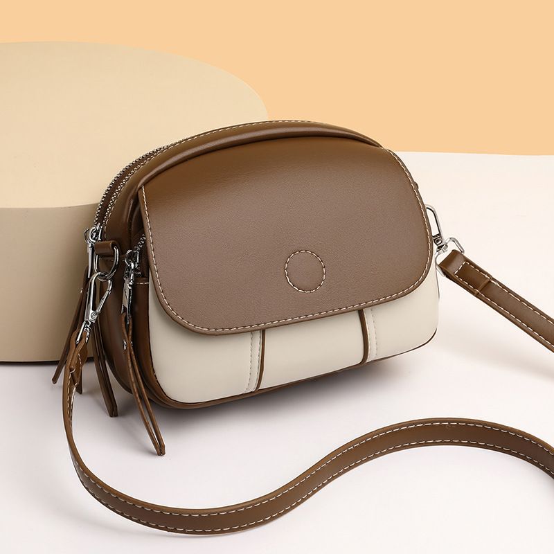 New women's bag fashion color matching zipper Joker shoulder bag mini messenger bag small round bag suitable for daily leisure commuting party.