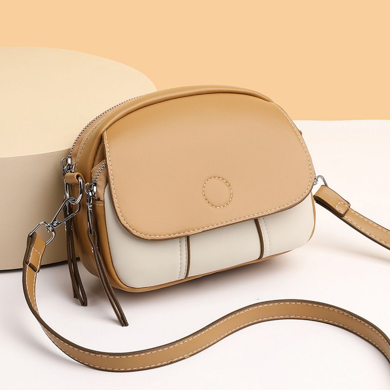 New women's bag fashion color matching zipper Joker shoulder bag mini messenger bag small round bag suitable for daily leisure commuting party.