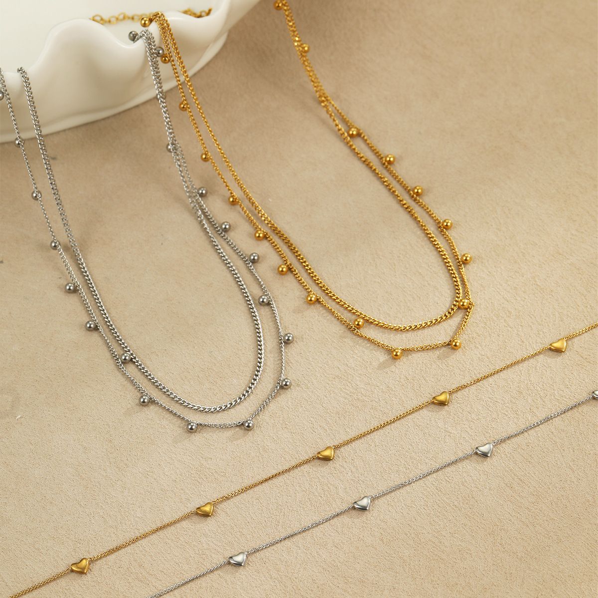Cross border hot selling multi-layer gold round bead stainless steel necklace in Europe and America, retro fashion layered gold necklace wholesale for women