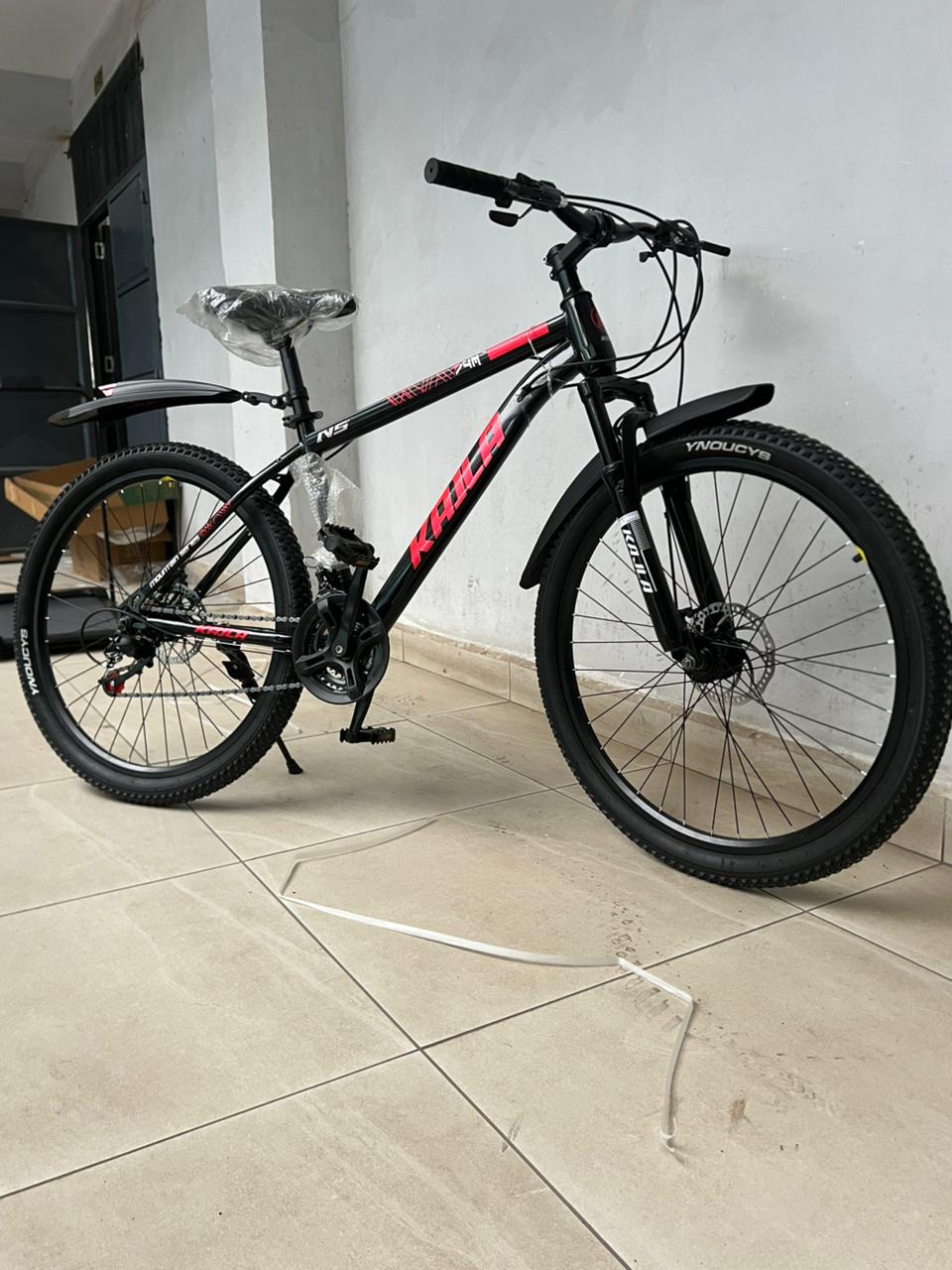 26-inch mountain bike. 
It features a durable steel frame, a multi-gear system, and a shock-absorbing front fork. 
The bike is equipped with disc brakes for reliable stopping power in various conditio