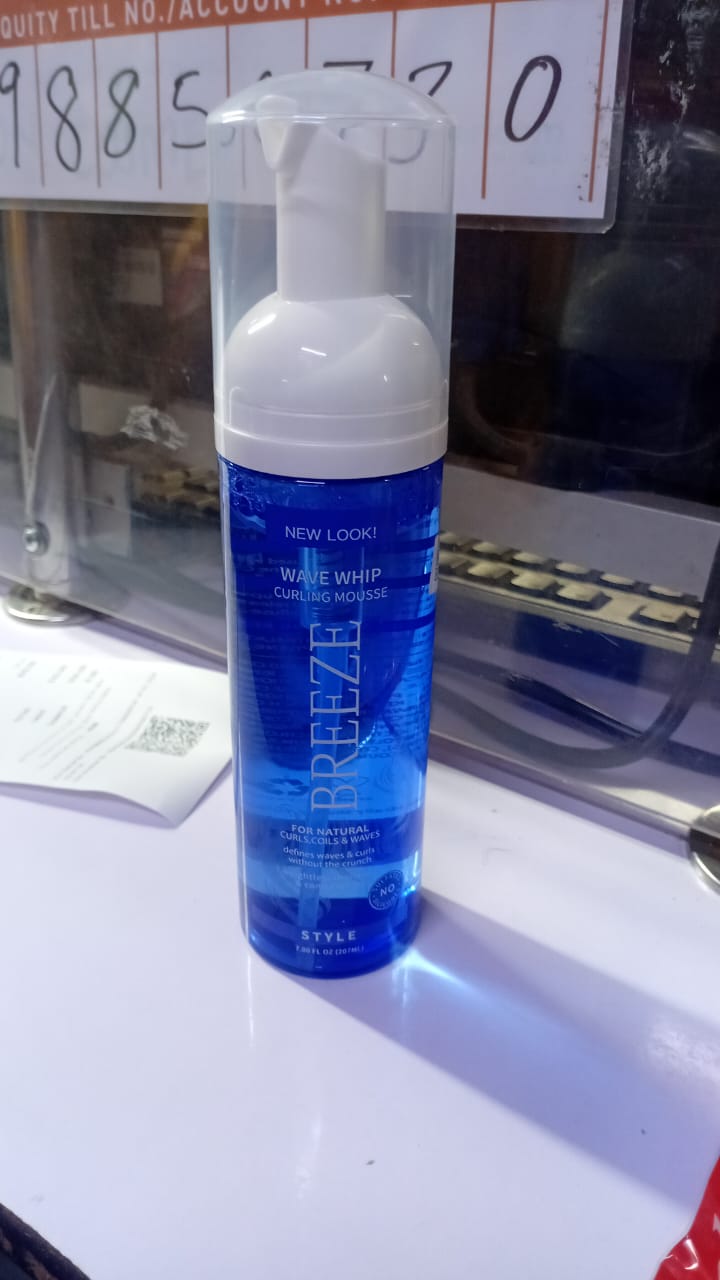 Breeze Weightless Moisture Conditioning Wave Whip Curling Mousse, a styling product designed to define curls and waves.