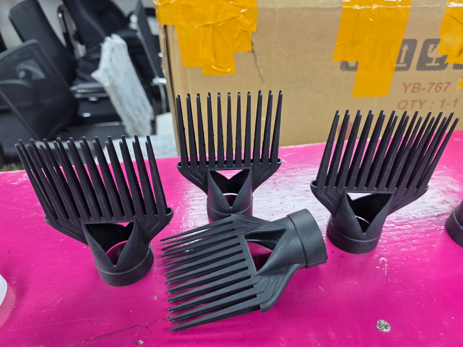 black hair dryer comb attachments, commonly used for styling and straightening thick or textured hair. 
Type: Professional hair dryer comb nozzle/attachment.
Material: Heat-resistant plastic.
Function