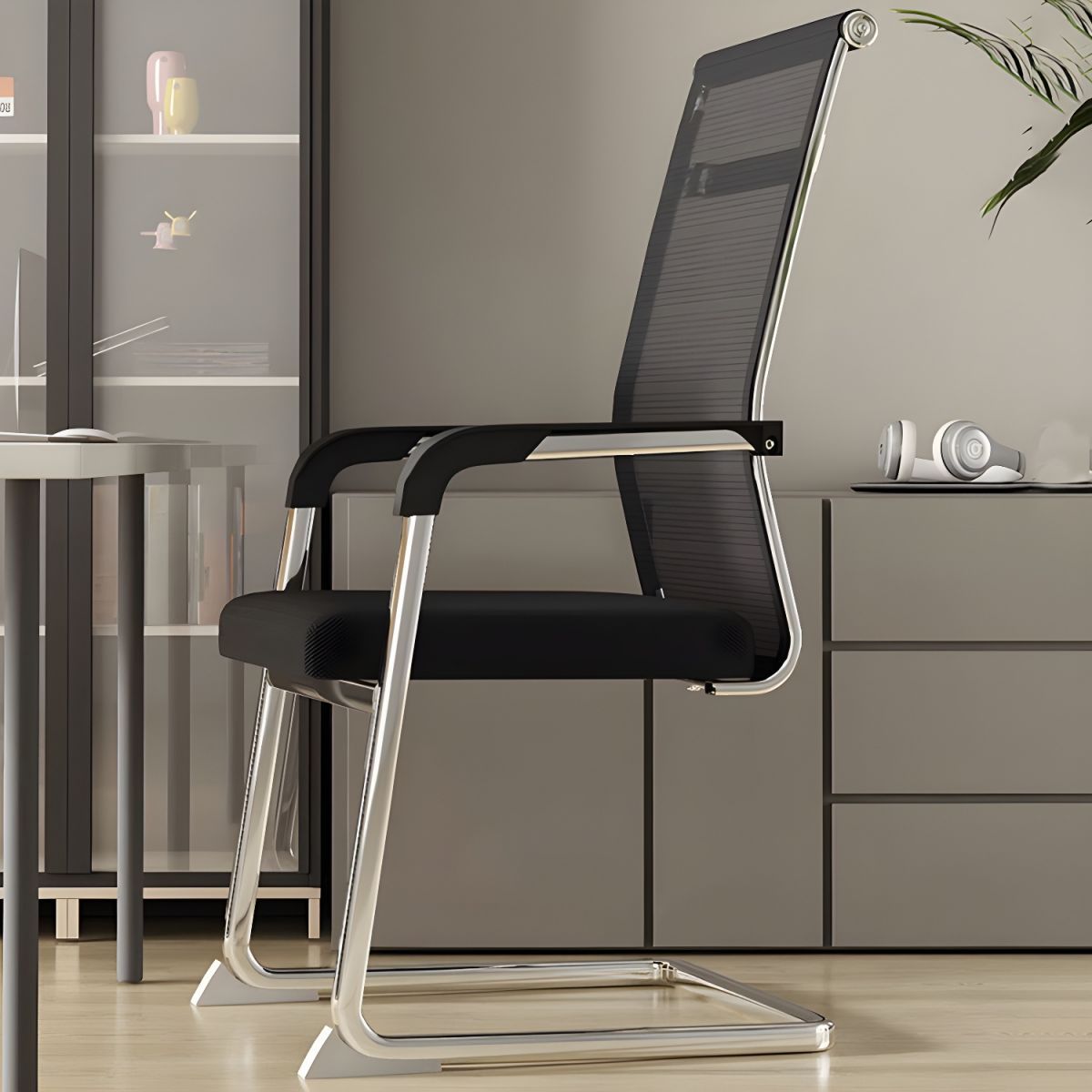 Ergonomic Mesh Back Conference Chair with breathable backrest, integrated armrests and sleek design in a modern office setting.