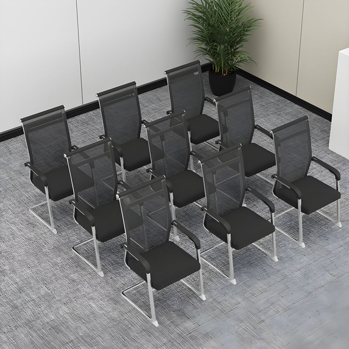 Ergonomic Mesh Back Conference Chair with breathable backrest, integrated armrests and sleek design in a modern office setting.