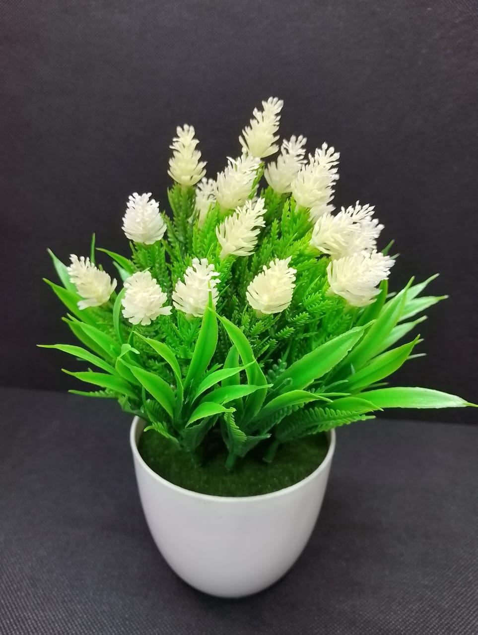 Table Top Artificial Rose Flower add a luxurious touch to your interior setting and the same time, it is a zero maintenance. Its arrangement ideas lights up your living space and brings physical effec