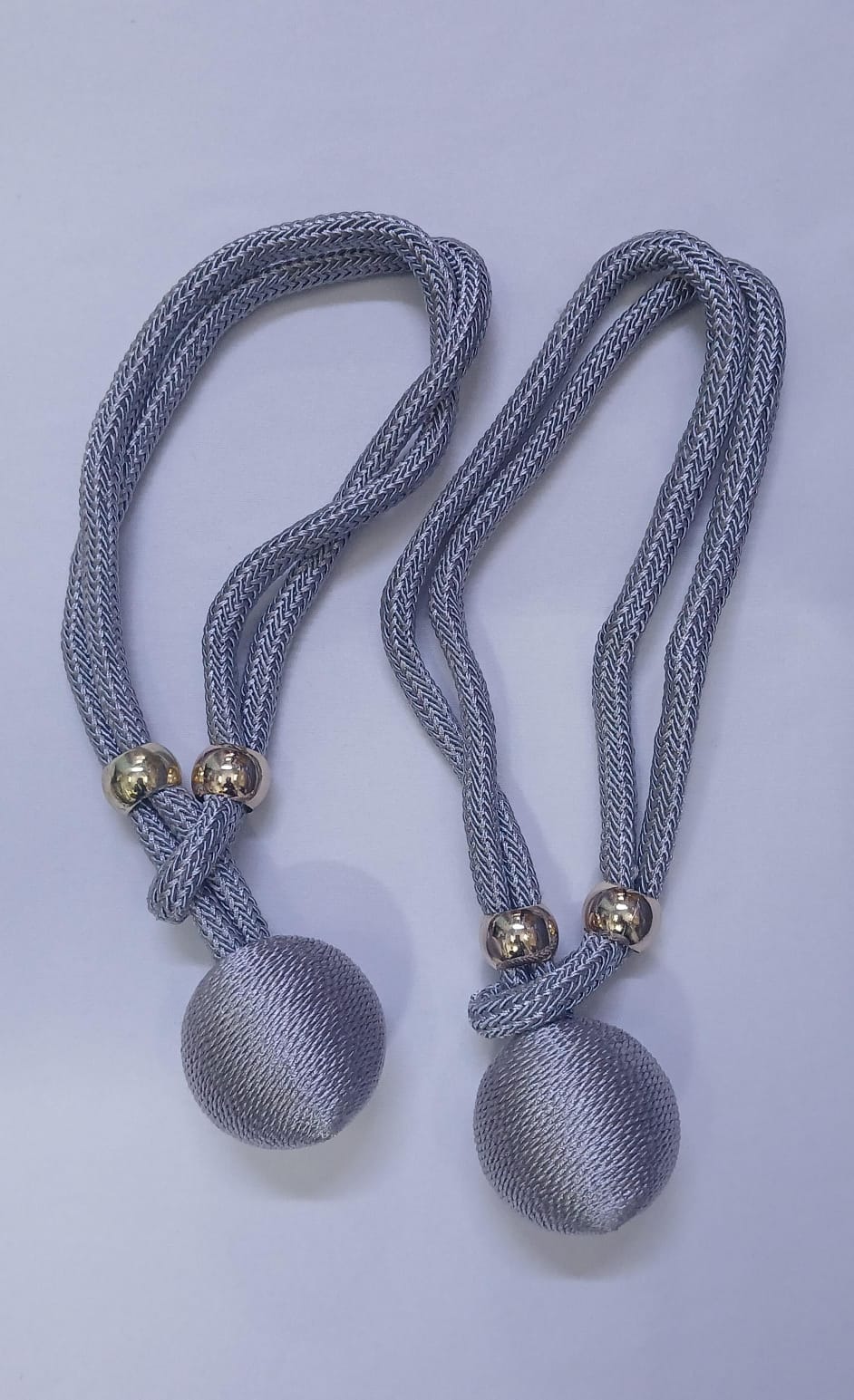 These elegant curtain tiebacks are a simple and stylish way to hold curtains neatly in place while adding a decorative touch to your space.