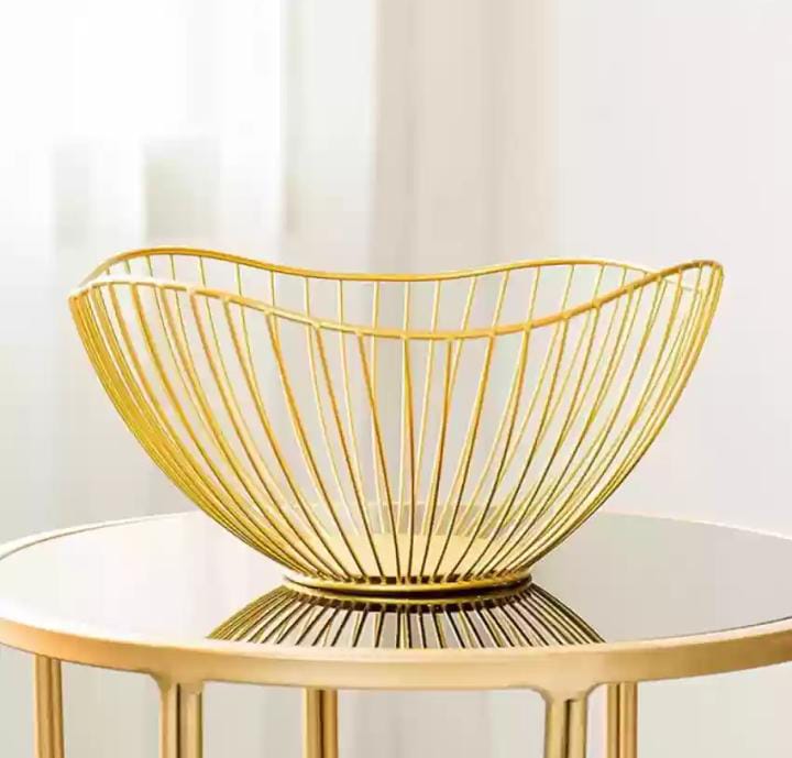 OVAL GOLDEN STAINLESS STEEL FRUIT BASKET - Our wire fruit basket is constructed to allow enough airflow to keep the fruit from going bad too quickly, and it is slim enough to easily put away .
