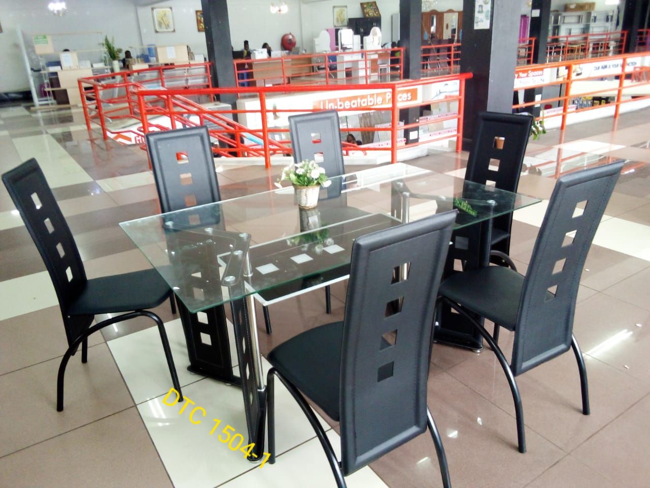 EXECUTIVE 6 SITTER GLASS DINNING TABLE WITH LEATHER SEATS - Elevate your dining experience with our exquisite 6-seater glass dining table, a perfect blend of sophistication and functionality .