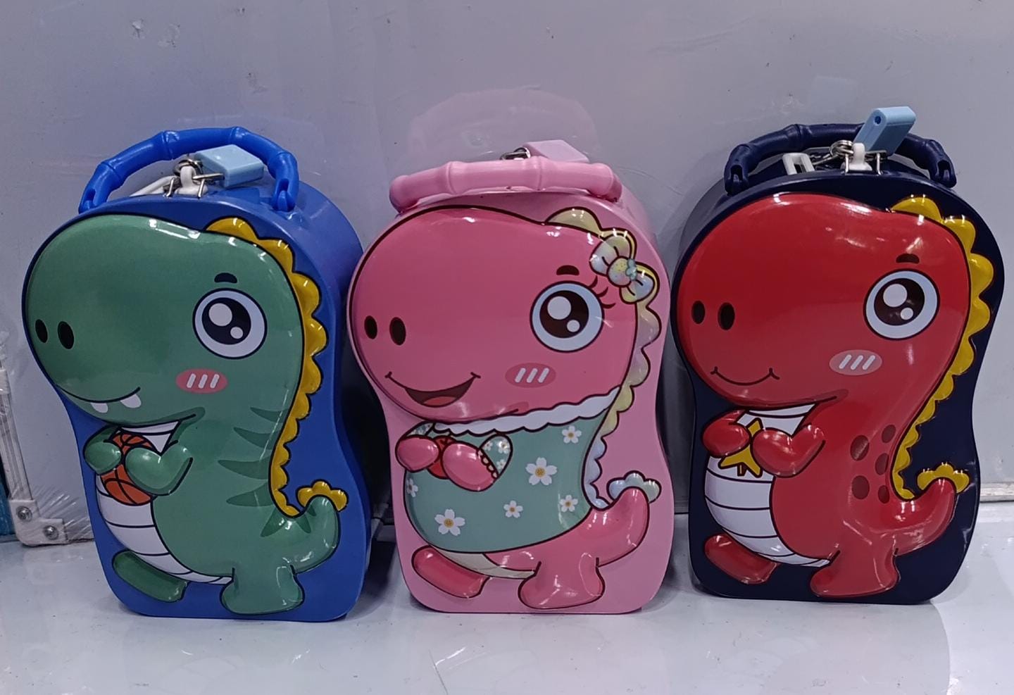 Kids Dinosaur Metallic Piggy Bank – Cute Lockable Money Box, Colorful metallic piggy bank with cute dinosaur design,Durable metal construction for safe coin storage,Built-in handle and lock for secure