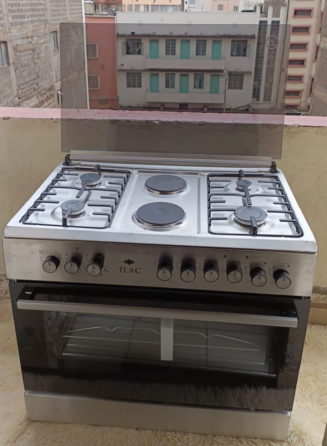 60*90 TLAC 4+2 STANDING COOKER WITH ELECTRIC OVEN, 4 gas burners + 2 electric Rapid Hot plate, Heavy Duty Matt Finish Burner Caps, Mechanical timer.
