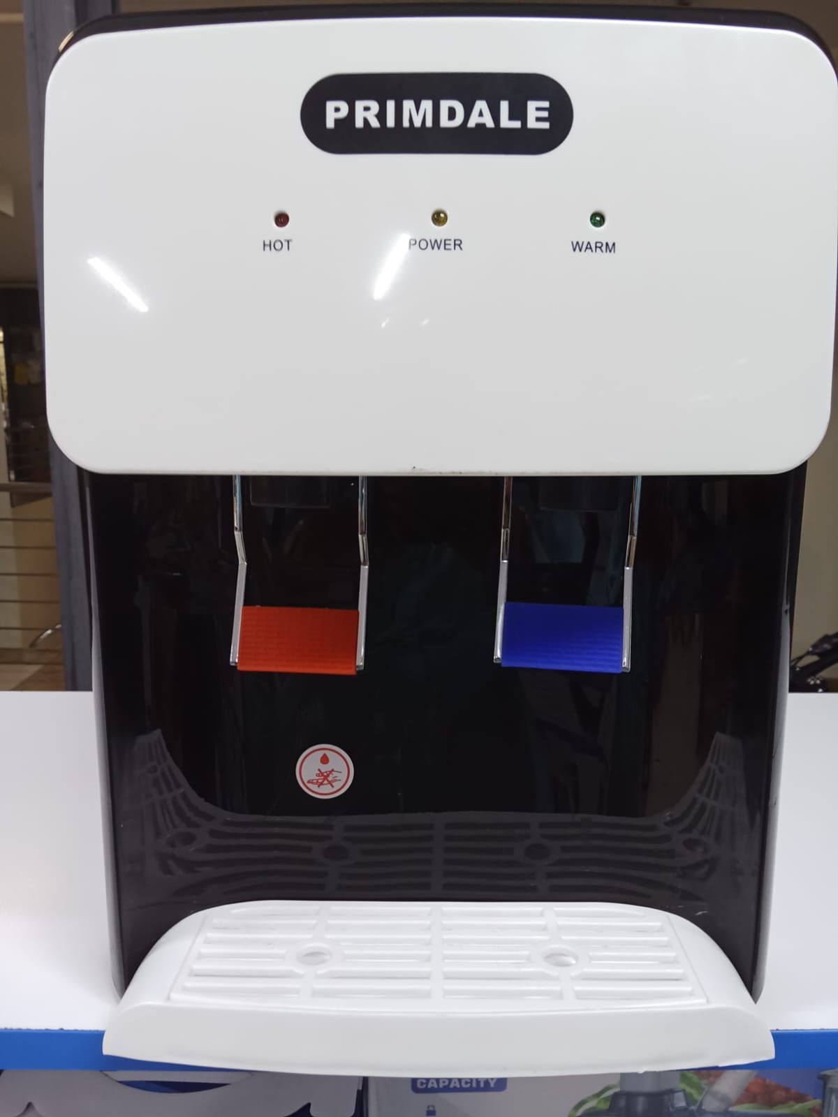 Primdale Table Top Hot & Normal Water Dispenser – Compact & Efficient, Fast heating system for instant hot water, Easy-to-use tap operation, Durable and energy-efficient performance.