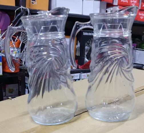 Glass jug Classic water shape is crafted with fire-polished rim. Machine-made using the latest technology to resemble the quality of hand-blown stemware at an everyday price. This Water Jug  features