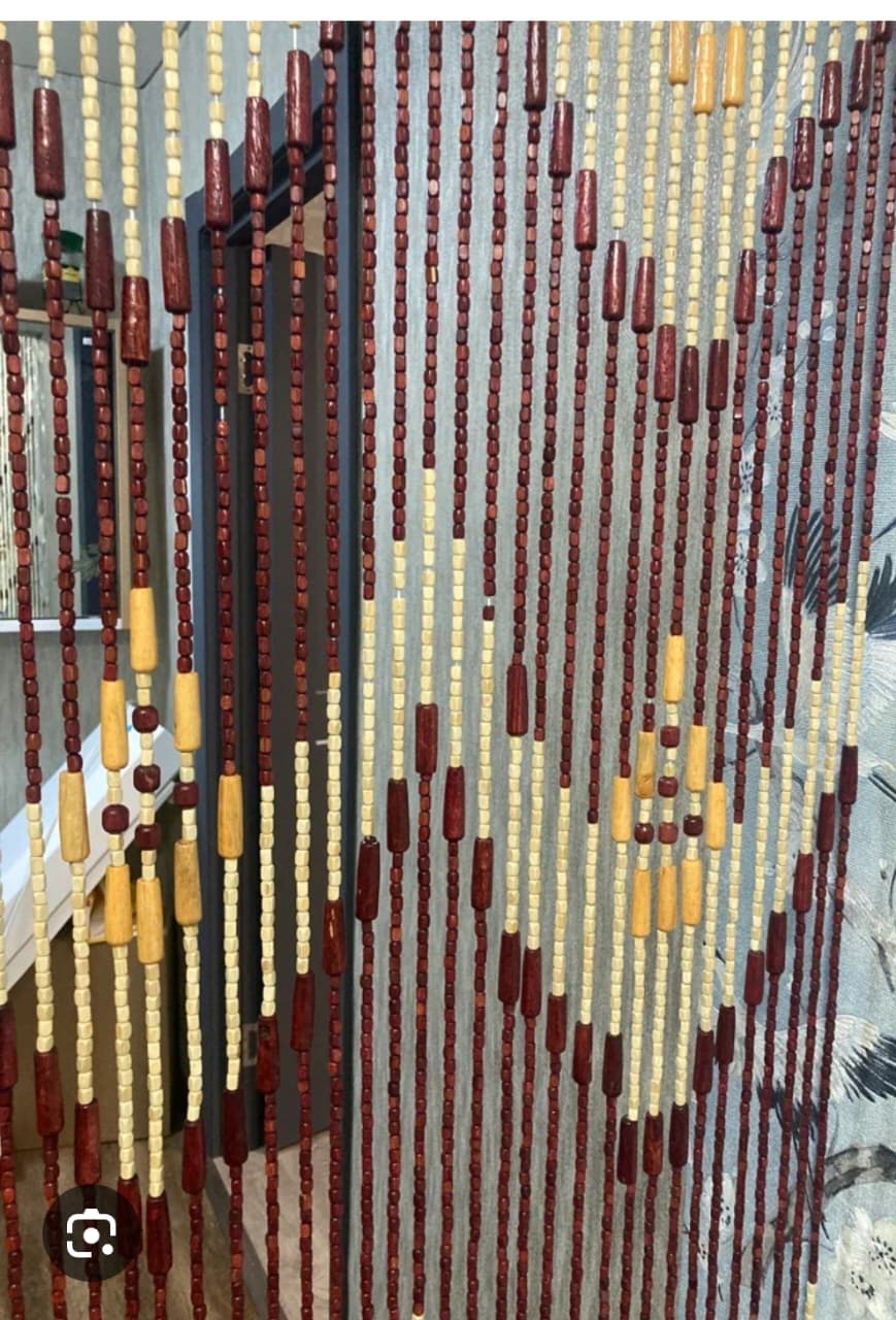 Wooden beads salon curtain Add a stylish, vibrant touch to your space with this Plastic Beads Curtain – perfect for salons, hotels, resting areas, and even your home. It offers a decorative way to div
