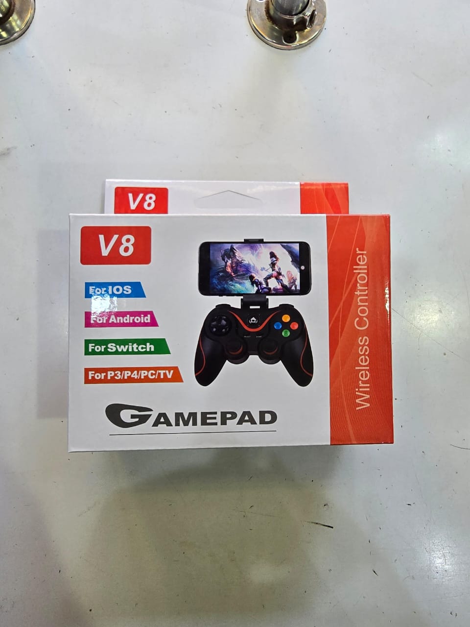 V8 Wireless Controller Gamepad. 
This device is a third-party gaming controller designed for wide compatibility across various platforms, including: 
Mobile Devices: iOS and Android smartphones and ta