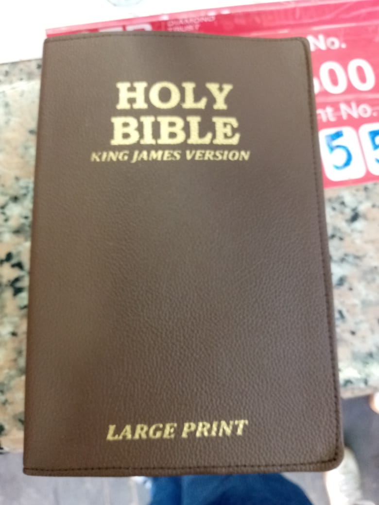 Holy Bible, King James Version (KJV), specifically a large print edition. 
The King James Version is an English translation of the Christian Bible for the Church of England, first published in 1611. I