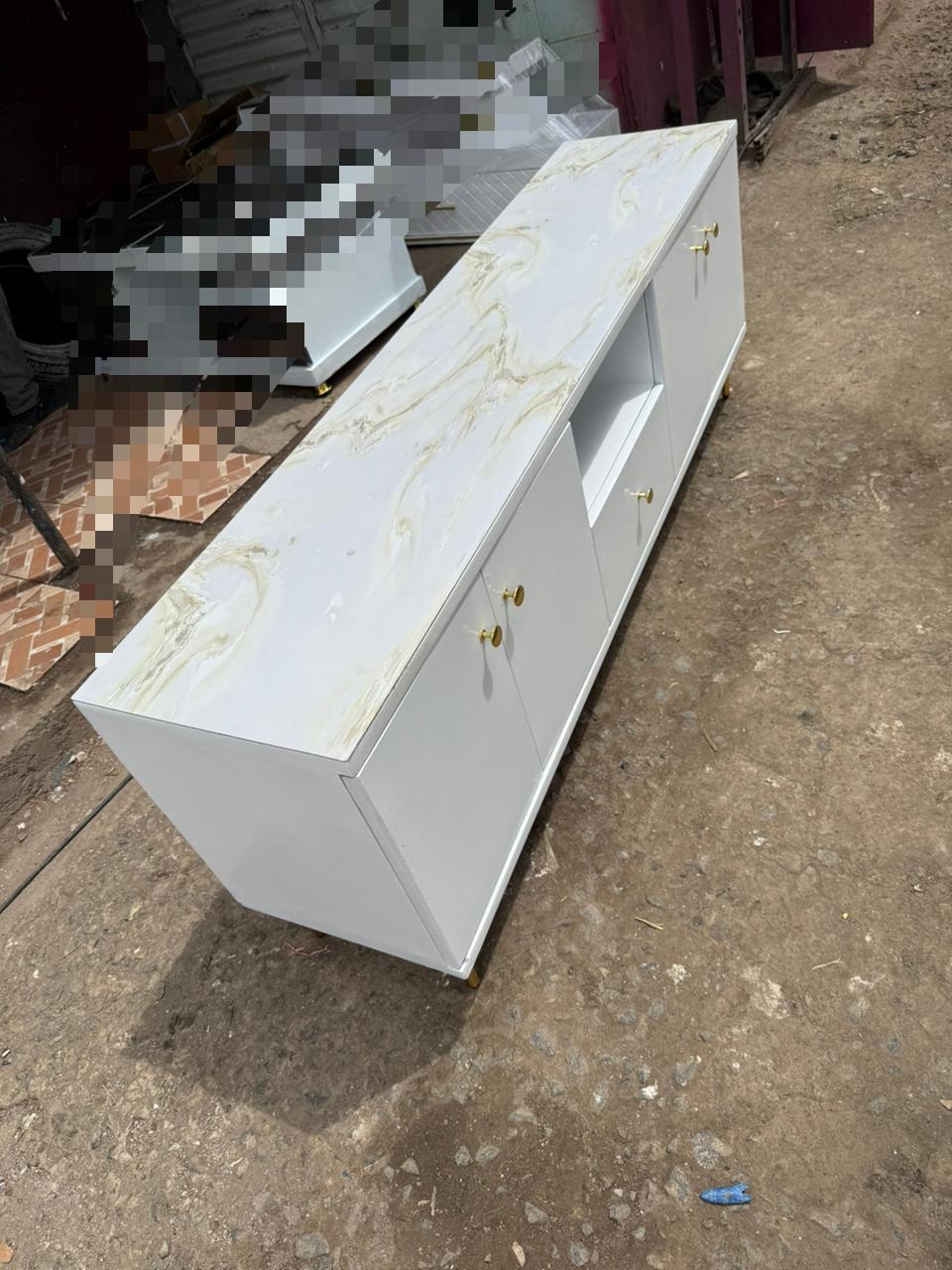 *5fts tv stand with marble top.crowned with a premium marble top that radiates elegance and sophistication.Designed with sleek lines, ample storage, and a stunning marble finish.
