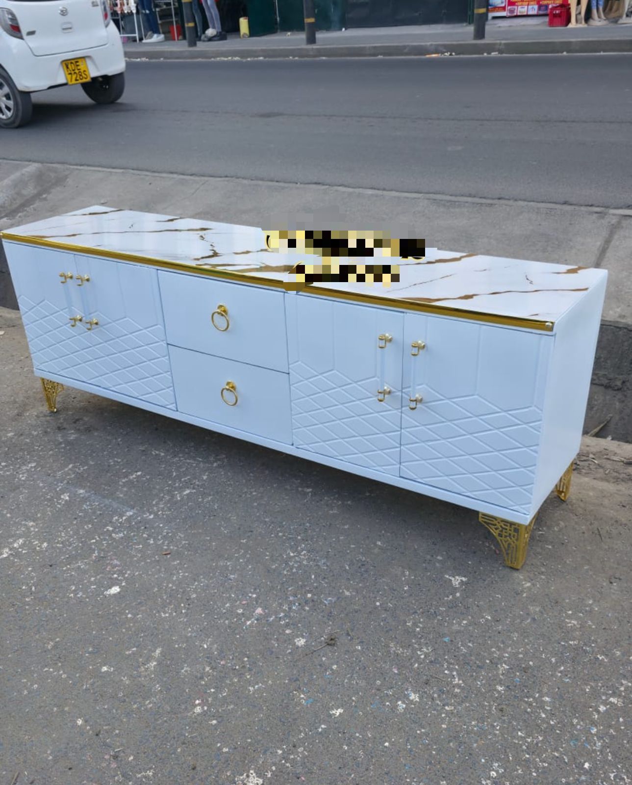 Upgrade your living room with this premium 6-foot TV stand featuring a luxurious marble-finish top, strong wood construction, and plenty of storage. Perfect for modern homes, apartments, Airbnbs, or e