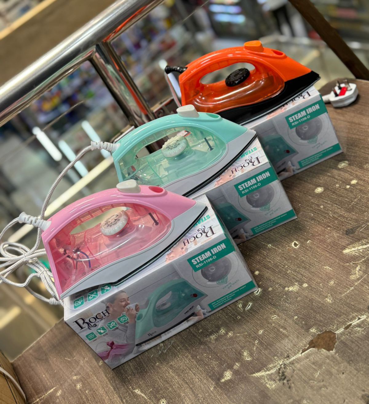 IRON BOX. Roch Steam Iron.  Fast-heating element for quick and efficient ironing,  Non-stick for smooth gliding and fabric protection, Adjustable settings for different fabric types, Comfortable grip